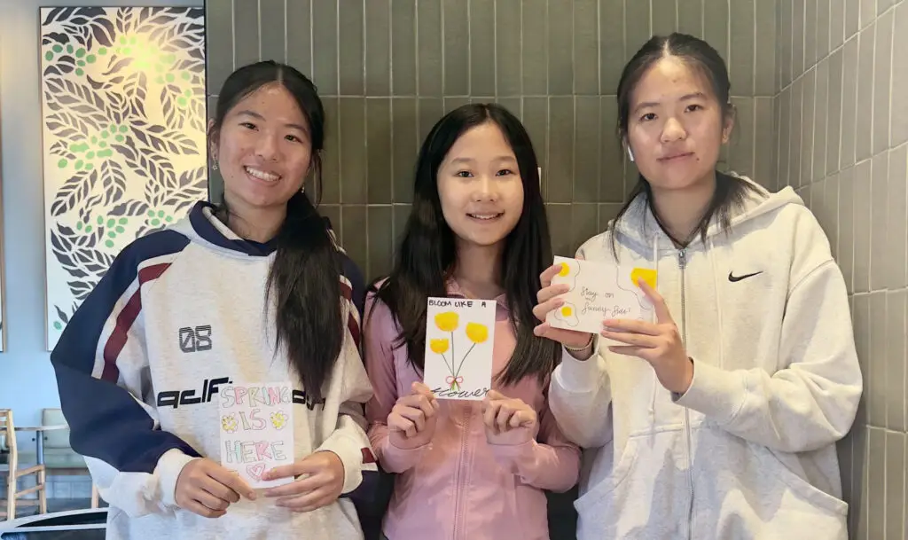 Ivy Tao and friends with cards for hunger relief at Midwest Food Bank