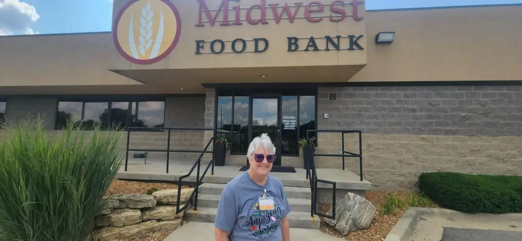 Volunteer Spotlight - Georgia Martin in front of Midwest Food Bank