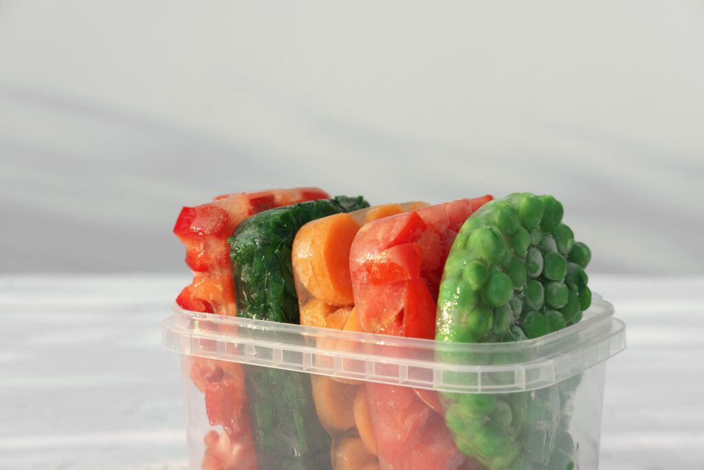frozen vegetables in clear container on white back 2026 09 23 01 52 48 utc
